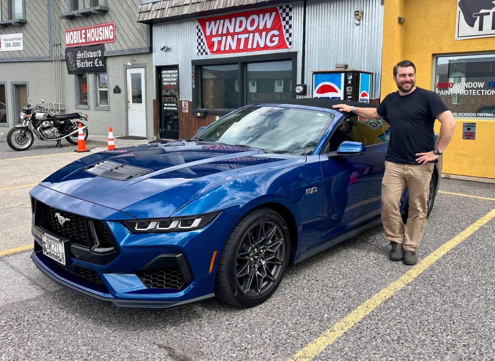 Blue sport sedan after window tint service