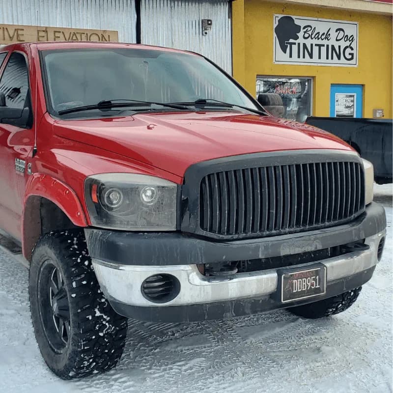 Red Dodge Ram tint project outside the shop
