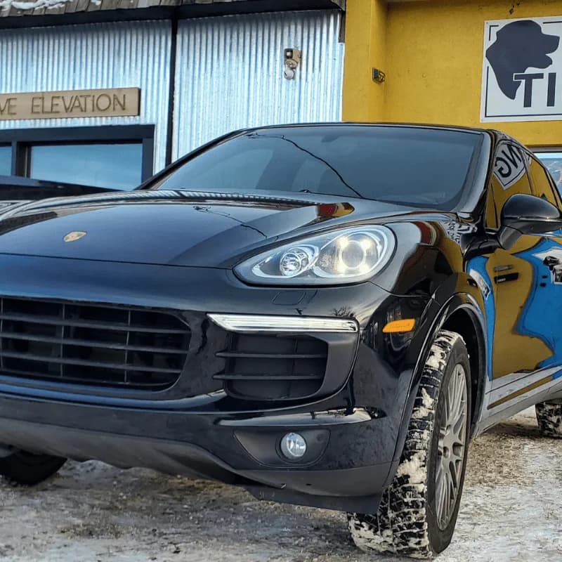 Black Porsche SUV outside Black Dog Tinting