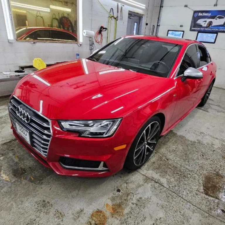 Red Audi in the Black Dog installation bay